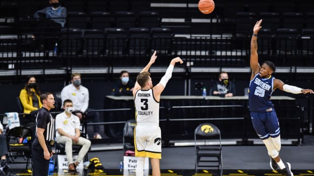 Nov 27, 2020; Iowa City, Iowa, USA; Iowa Hawkeyes guard Jordan Bohannon (3) shoots the ball over Southern University Jaguars guard Samkelo Cele (25) during the second half at Carver-Hawkeye Arena. Mandatory Credit: Jeffrey Becker-USA TODAY Sports